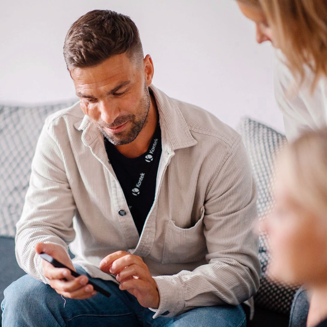Man looking at the payroll system on his mobile phone