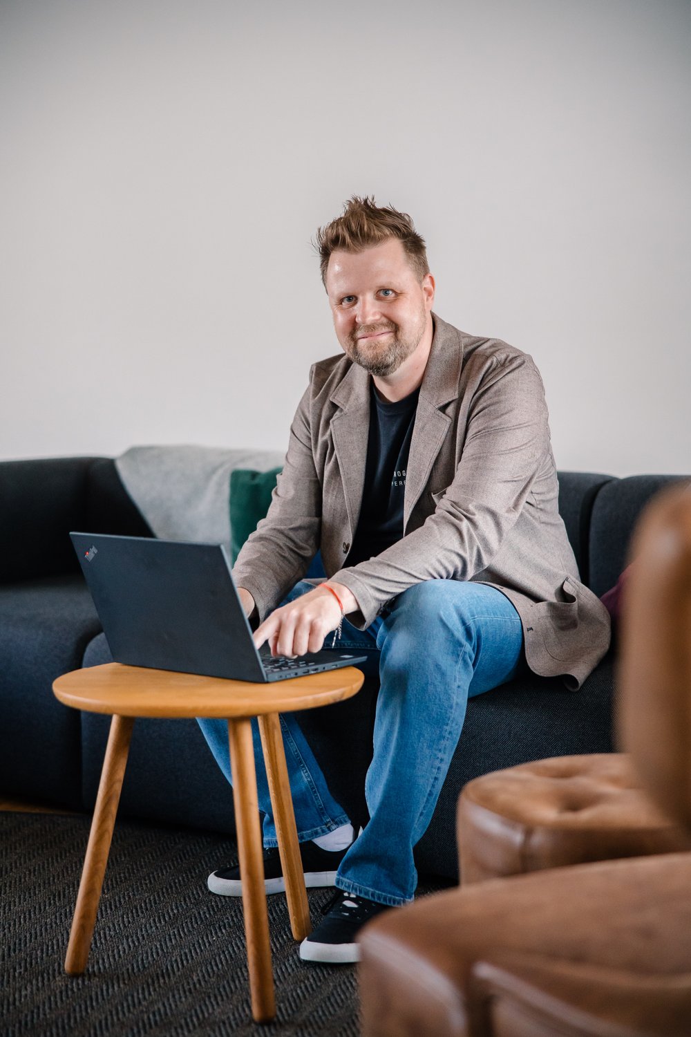 Man sitting on a sofa with his laptop