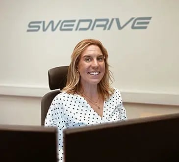 girl sitting in an office at a computer